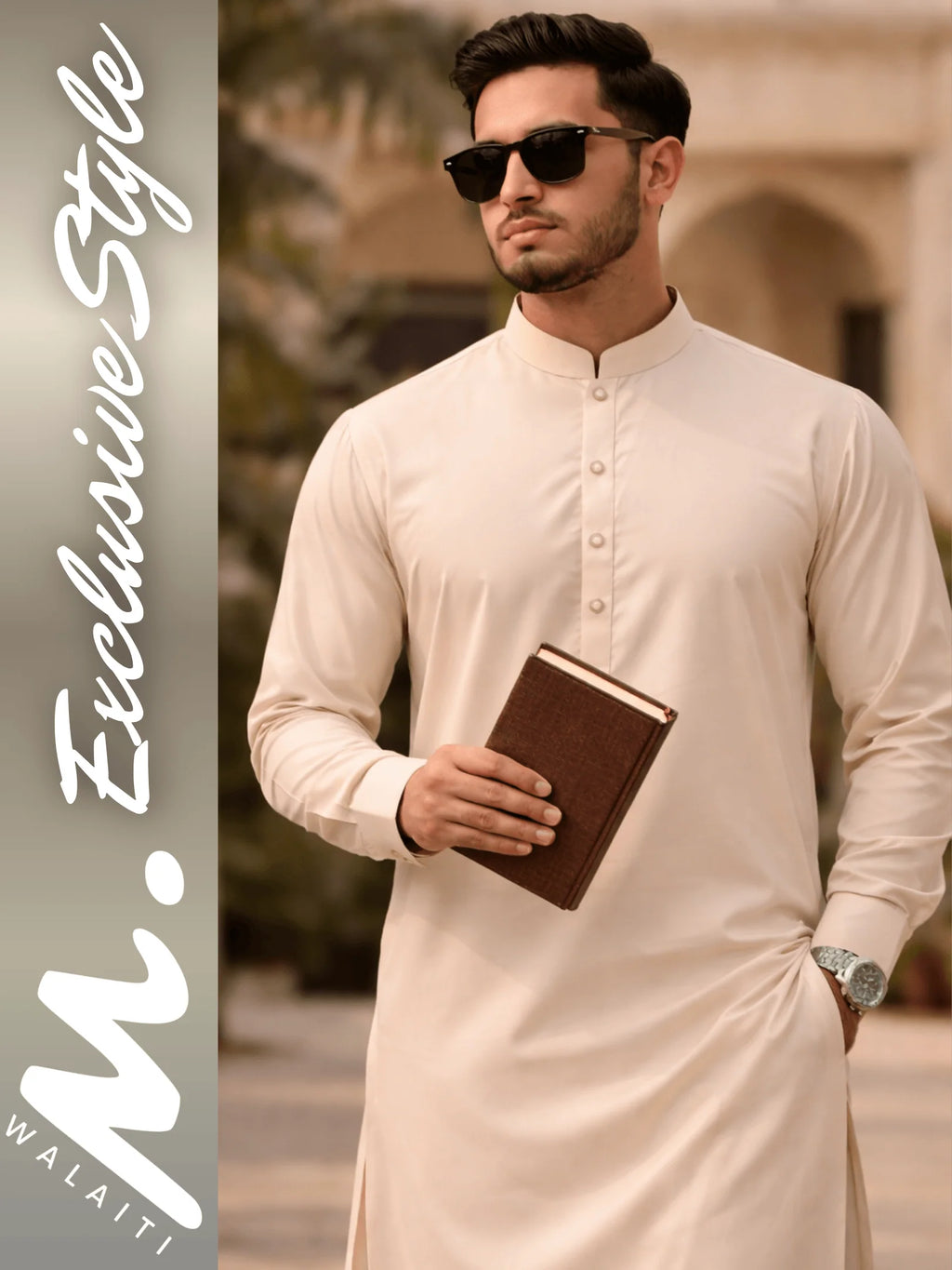 Man wearing a beige kurta holding a book with walaiti. Exclusive Style' branding.
