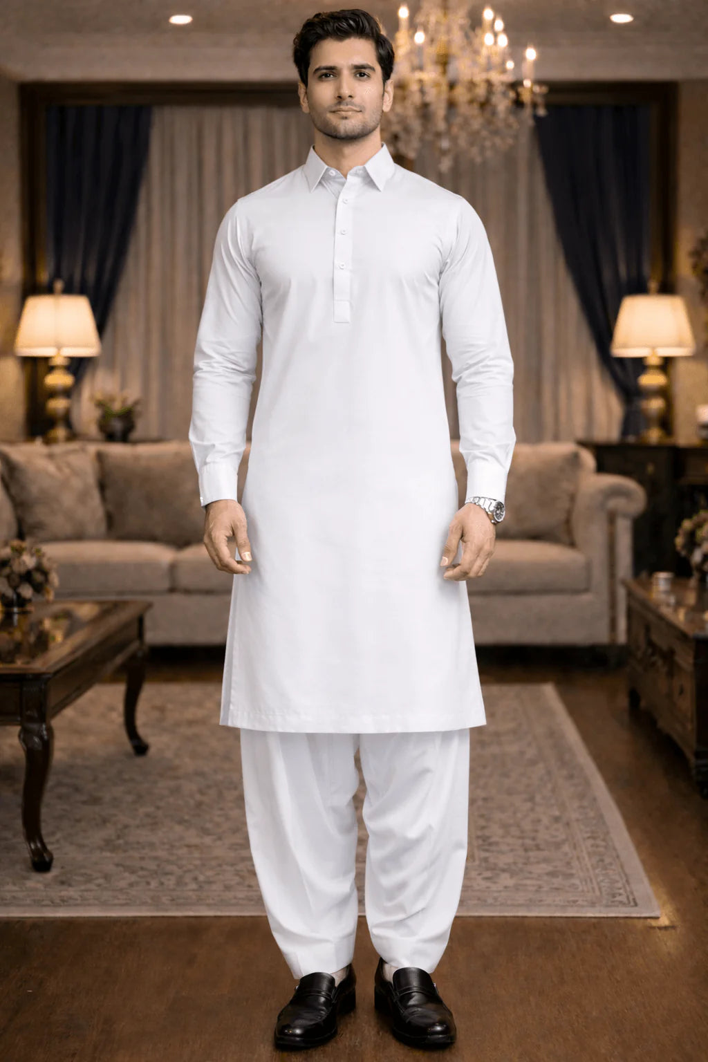 Man wearing a white kurta set in a living room setting