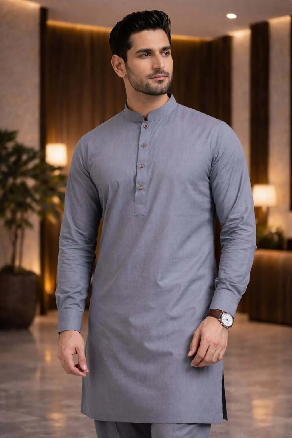 Man wearing a gray kurta in an indoor setting